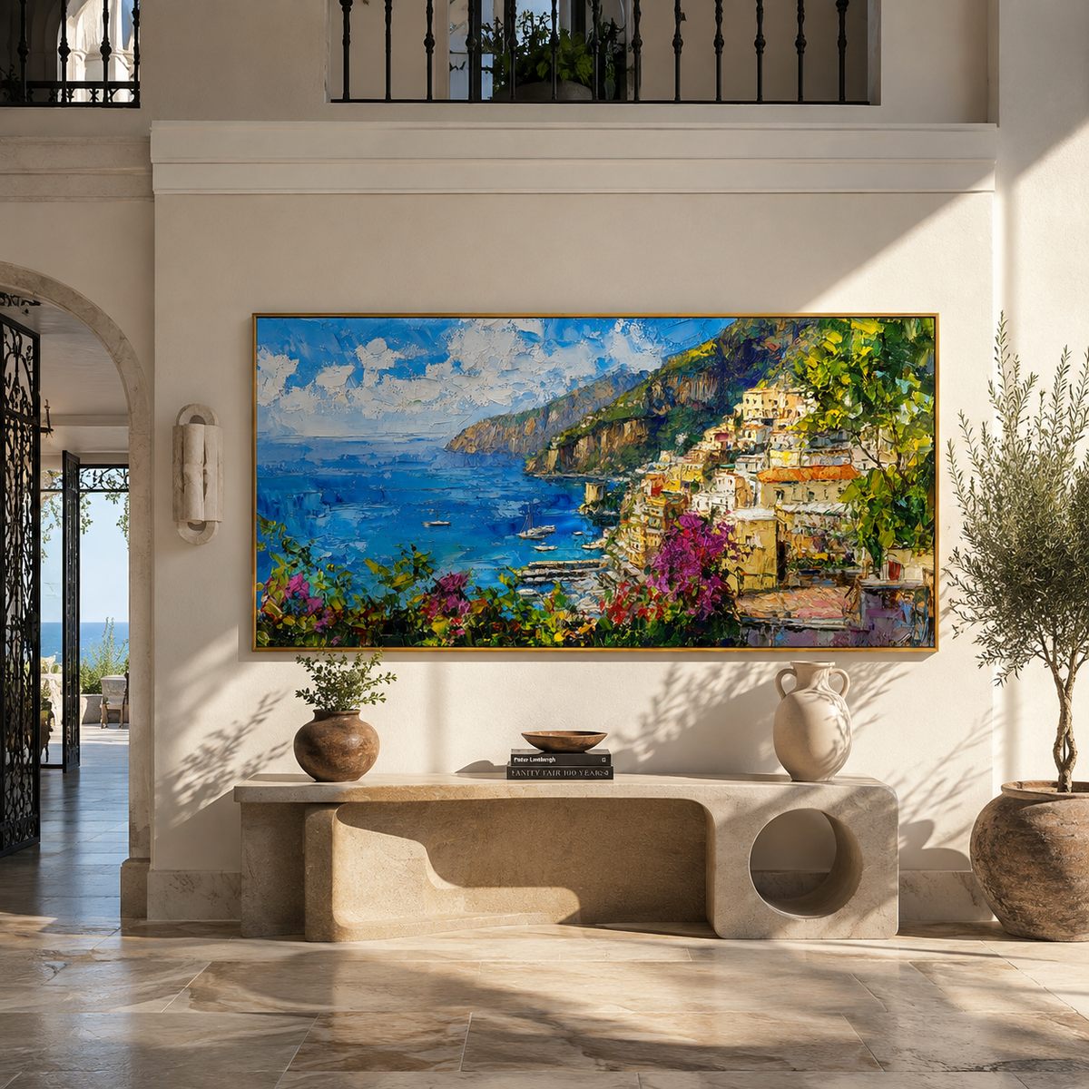Panoramic coastal village painting displayed above a long living room sofa