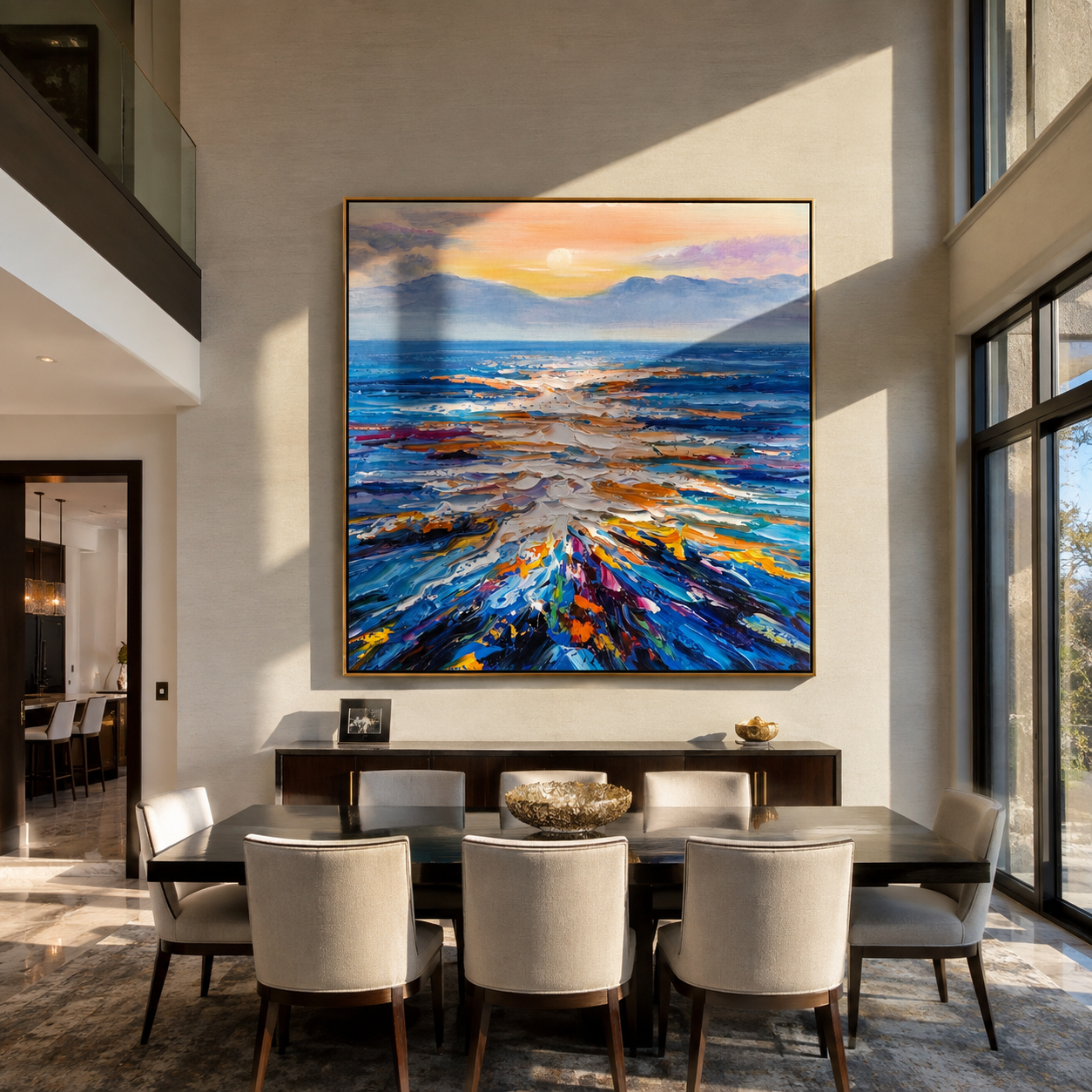 Abstract sunset seascape painting displayed above a living room sofa