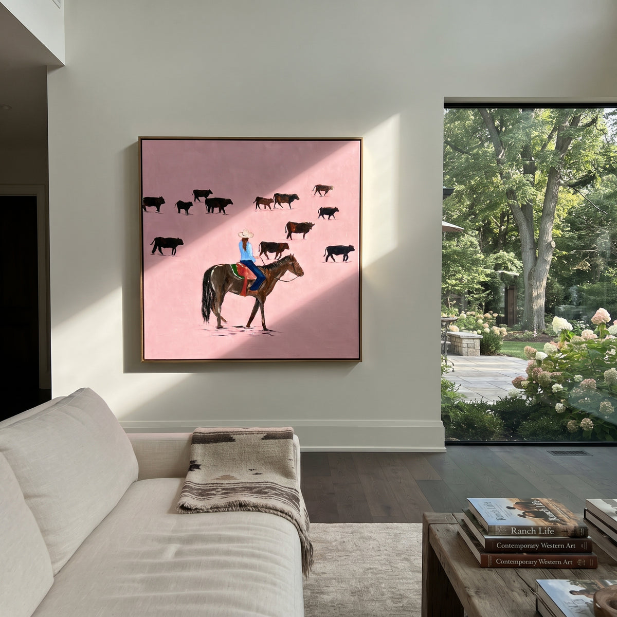 Pink Range Roundup - cowboy herding cattle painting shown in modern room setting 4