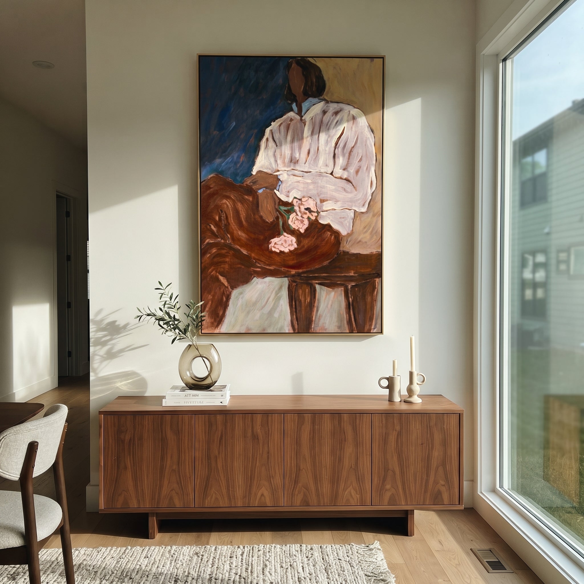 Striped Chair Faces Shadow presented above a contemporary console