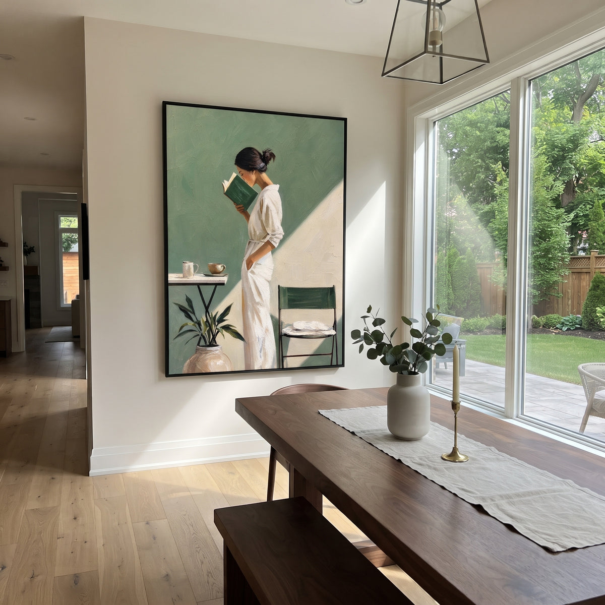 Reading in Sage Light - woman reading in sage interior painting displayed in a styled interior