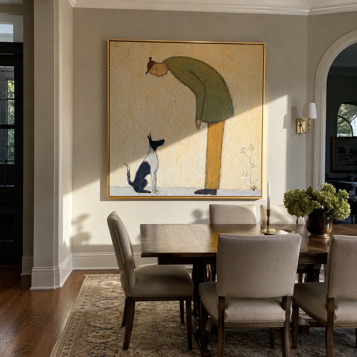 Black Cat Looks Up person bending to cat painting displayed in a styled interior