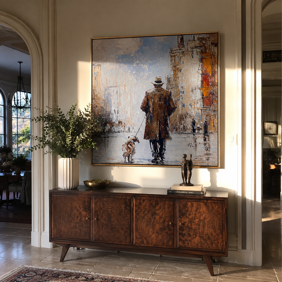 Snow Street Shared Steps man and dog winter city painting displayed in a styled interior