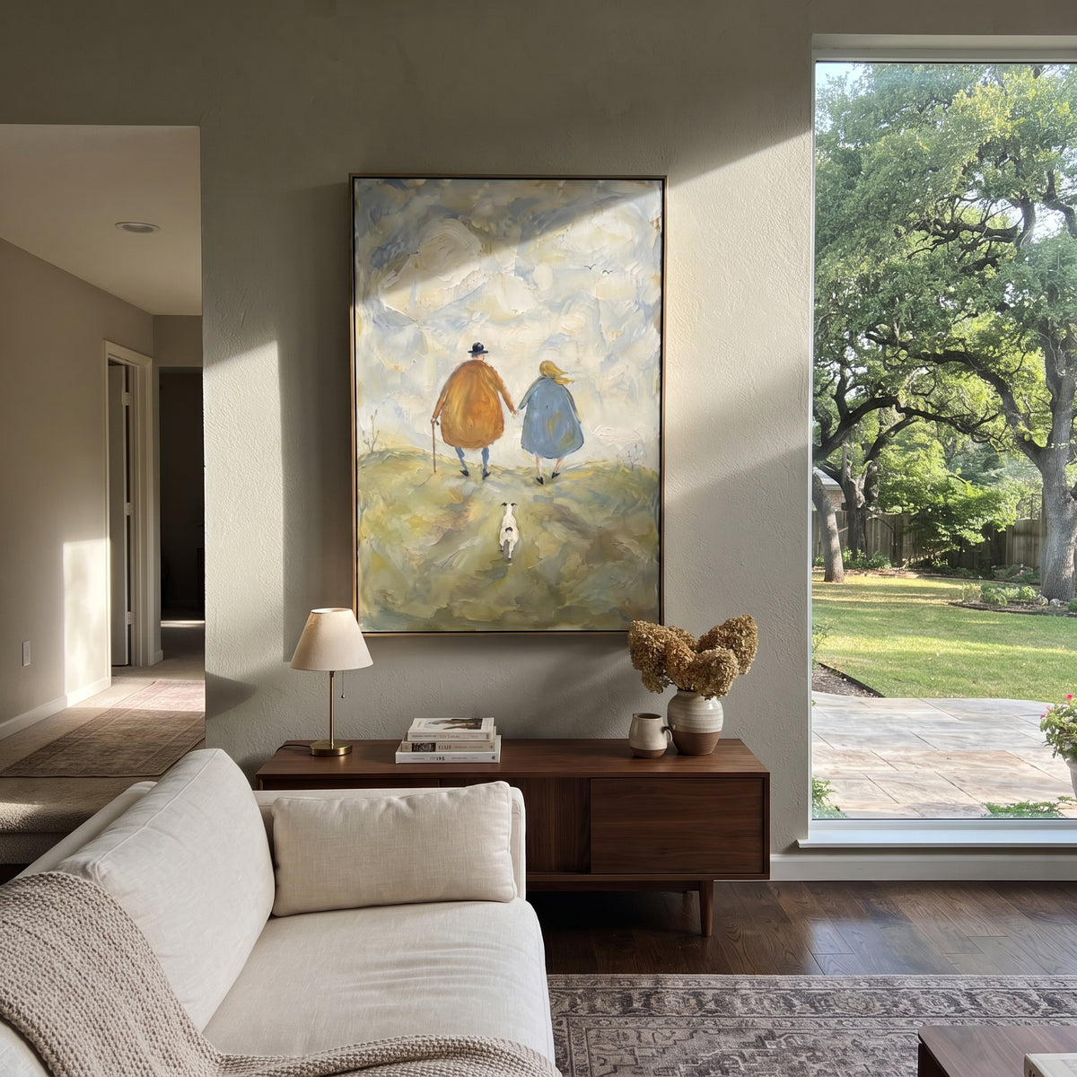 Winter Path for Three elderly couple and dog painting displayed in a styled interior