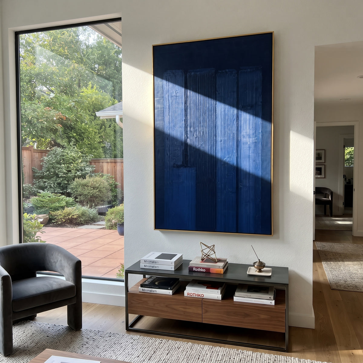 Blue Chambers Glow cobalt blue geometric painting displayed in a styled interior