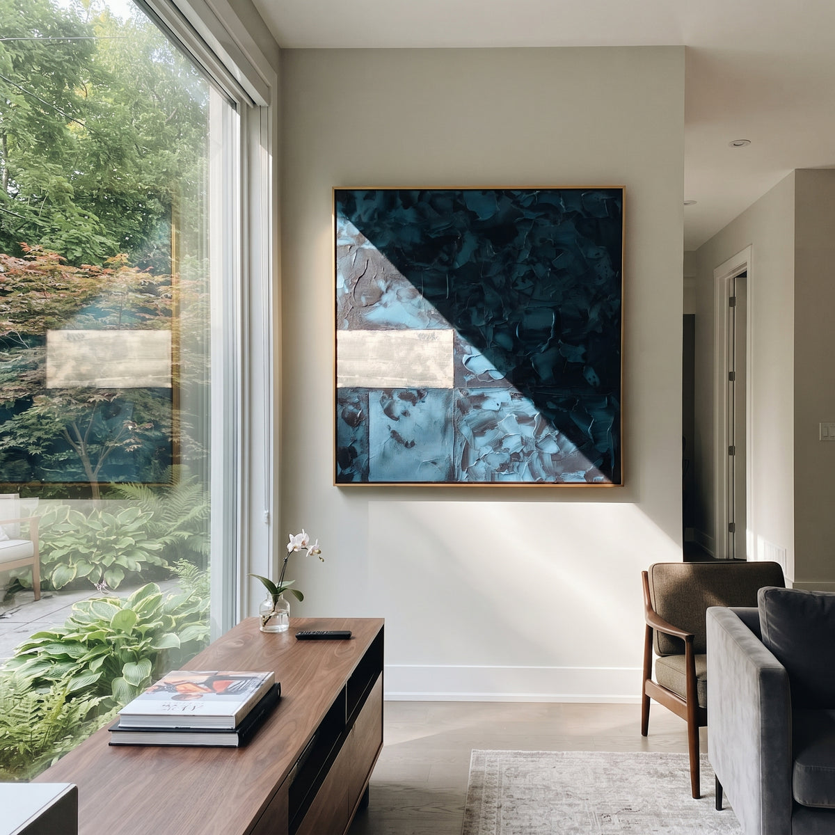 Teal Chambers Hold Silver teal navy geometric square painting displayed in a styled interior