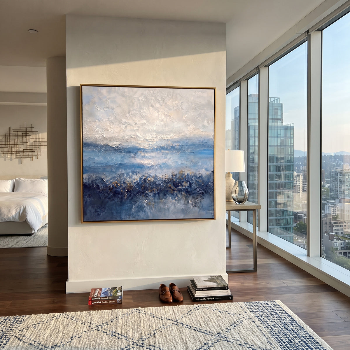 Blue Horizon in Snow blue white textured seascape painting displayed in a styled interior
