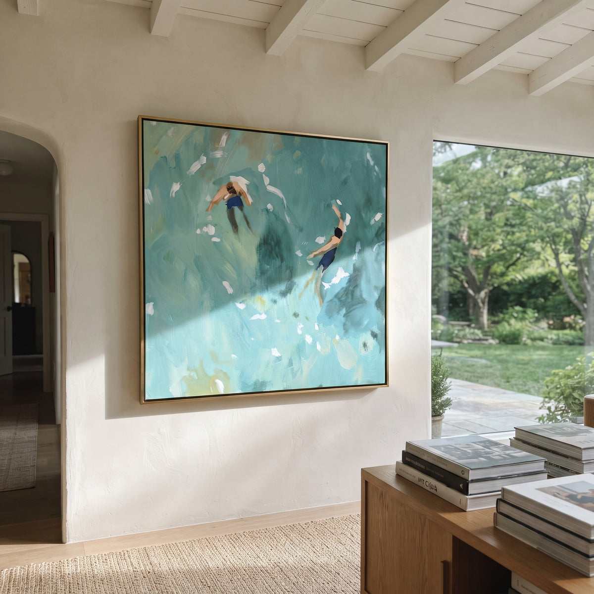 Turquoise Drift - two swimmers painting displayed in a styled interior