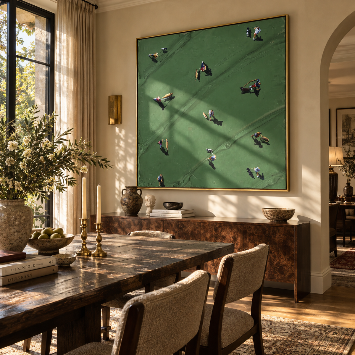 Gathering on the Green - aerial figures painting displayed in a styled interior