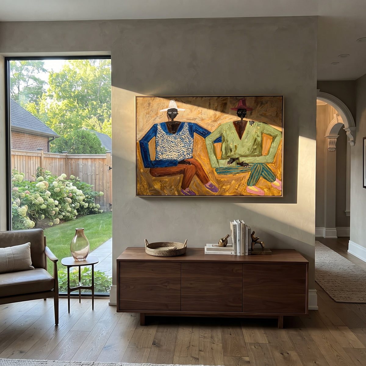 Two Brims Golden Conversation seated western figures painting displayed in a styled interior