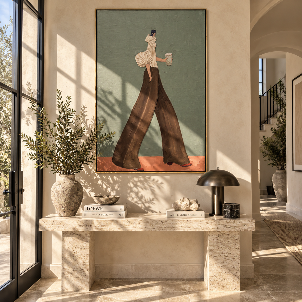 Chocolate Steps Grey Morning – woman in a pale striped puff-sleeve blouse and chocolate trousers carrying a gray coffee cup, displayed in a styled contemporary interior