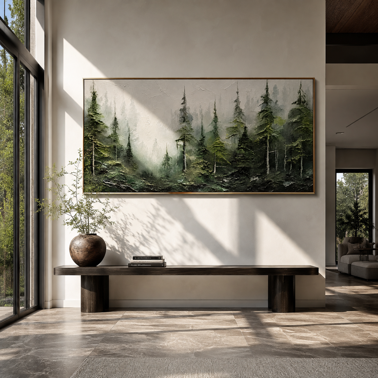 Misty green forest painting displayed above a console in a marble entryway