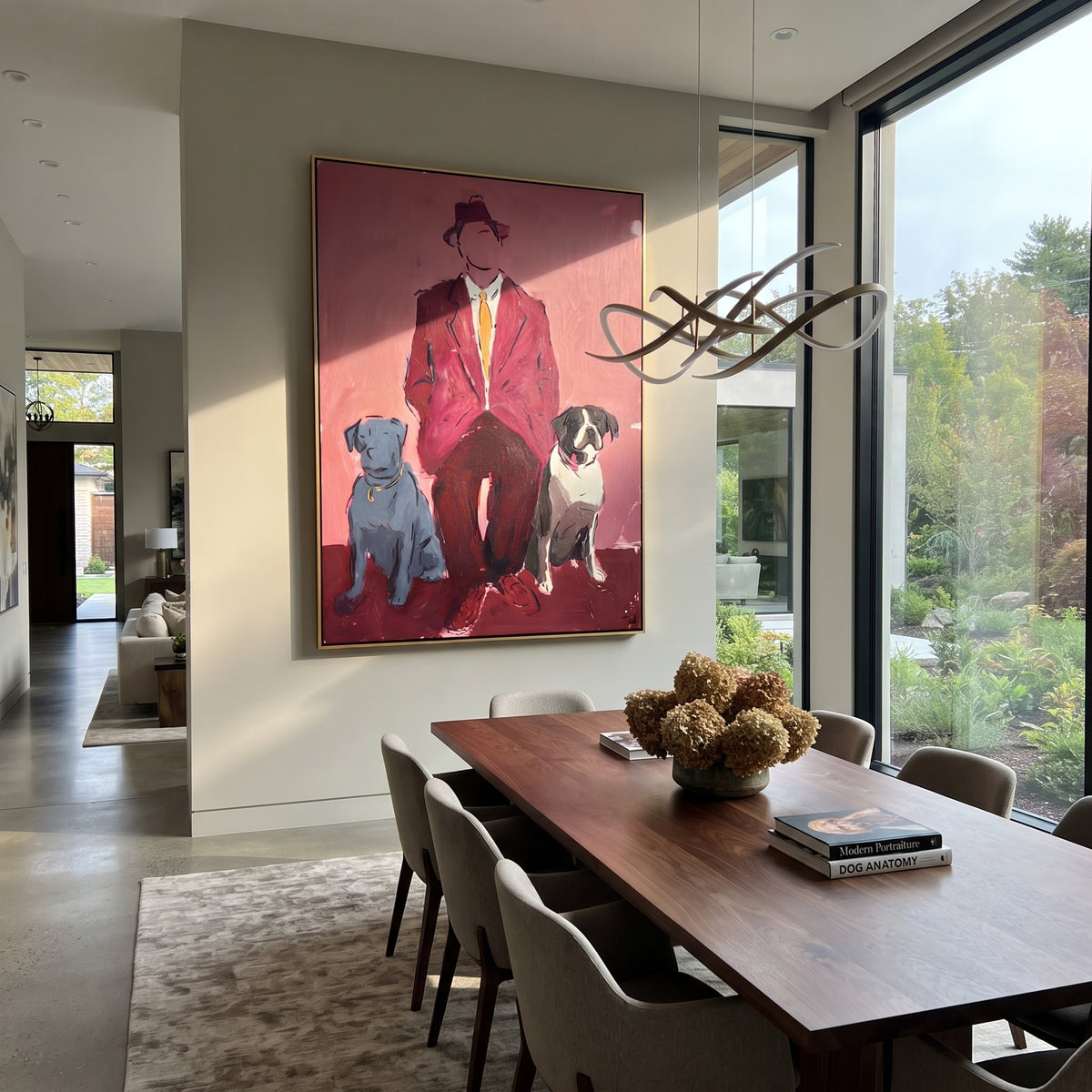 Red Suit Keeps Company people and pets wall art above contemporary furnishings