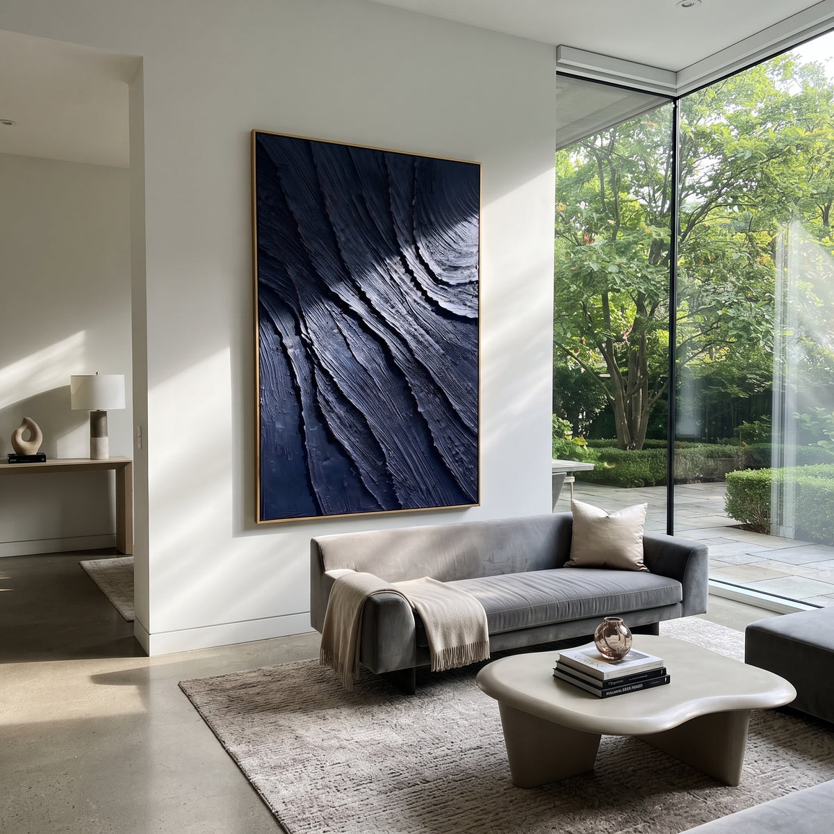 Midnight Currents Fold navy blue layered texture painting displayed in a styled interior