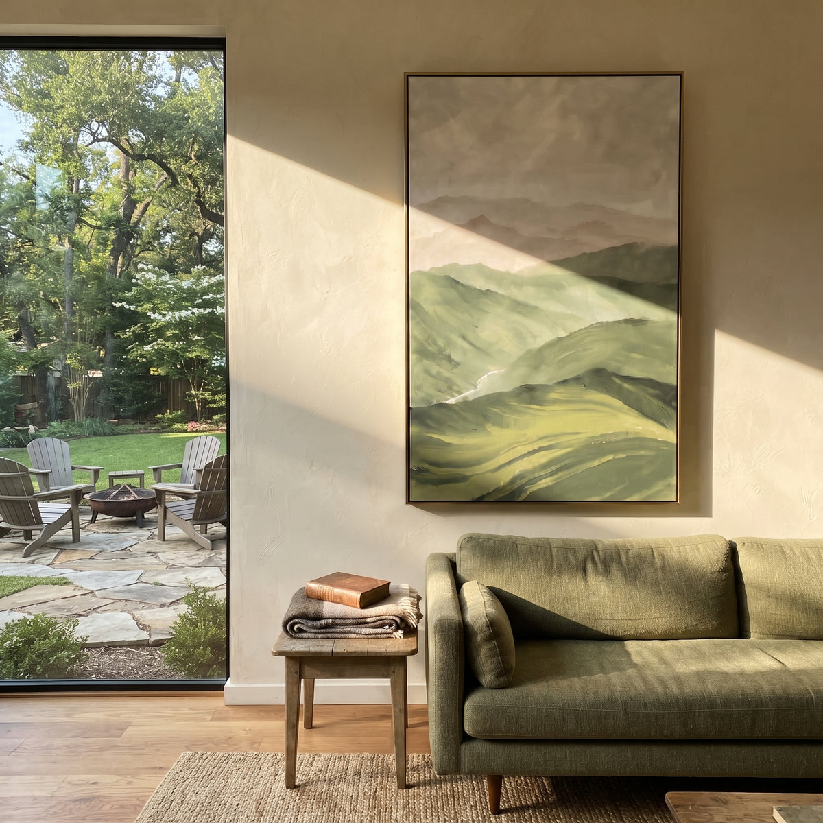 Mountains Fade Into Sage sage green mountain landscape painting displayed in a styled interior