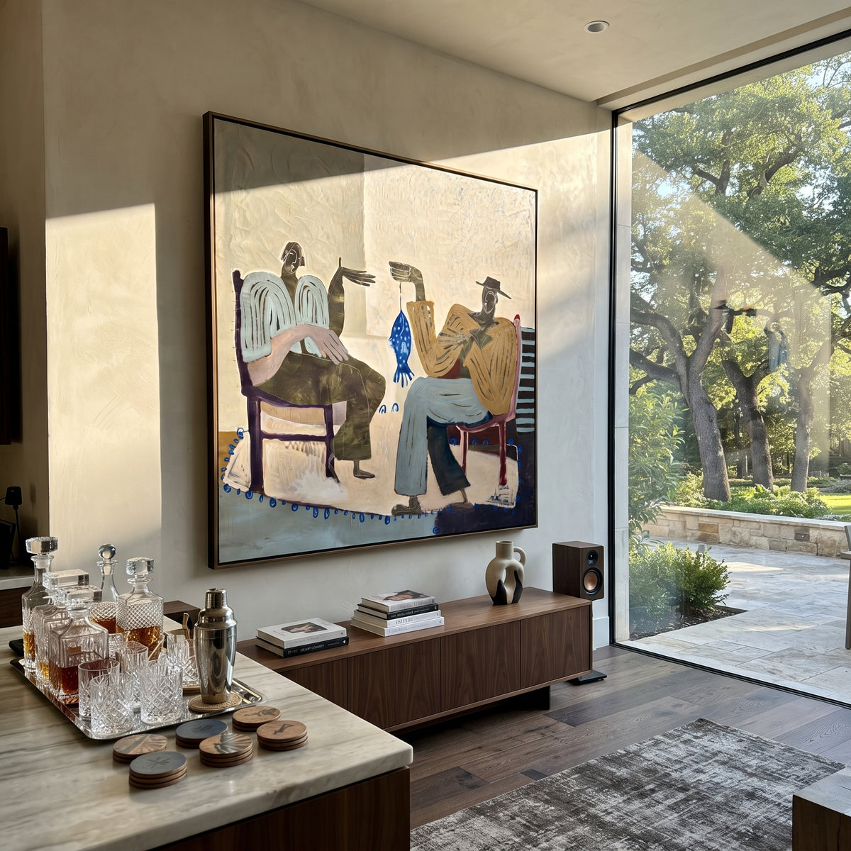 The Blue Fish Between Us - two seated folk figures painting, modern figurative square textured wall art - displayed above a living room console