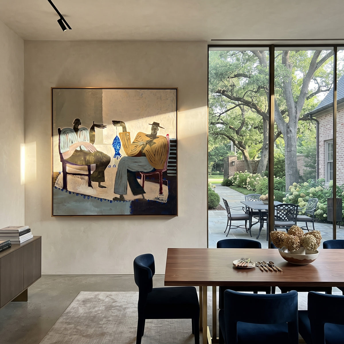 The Blue Fish Between Us - two seated folk figures painting, modern figurative square textured wall art - displayed over a dining sideboard