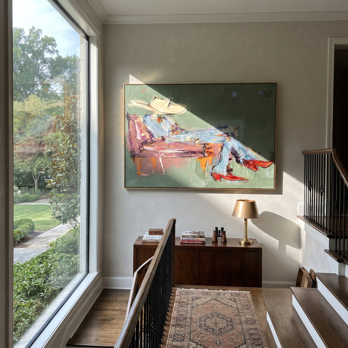 Sage Room, Crimson Boots - reclining cowboy painting shown in modern room setting 2